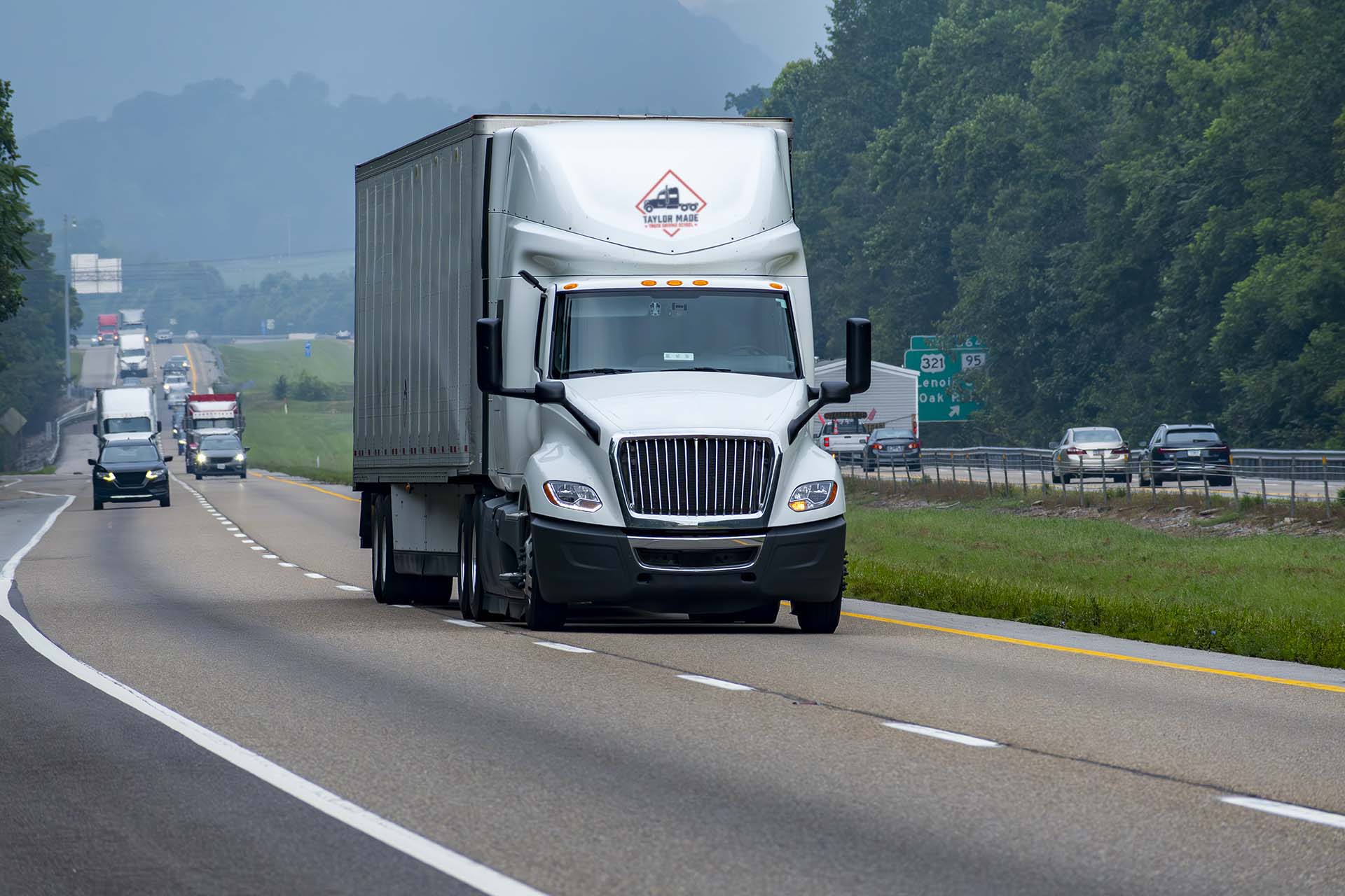 Semi-truck on Pacific Northwest highway during Class A driving training